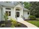 Close up of front entrance highlighting architectural details and landscaped yard at 12301 Hardee Rd, Raleigh, NC 27614