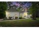 Charming white brick home with manicured landscaping and walkway to the front door at 12301 Hardee Rd, Raleigh, NC 27614