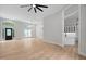 Spacious living room with hardwood floors, modern light fixtures, and view to the kitchen at 12301 Hardee Rd, Raleigh, NC 27614