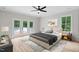 Main bedroom featuring a ceiling fan, view to the pool, and access to the outdoor deck at 12301 Hardee Rd, Raleigh, NC 27614