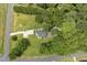 Large property with a home nestled among trees and a long driveway at 133 Creekstone Dr, Benson, NC 27504