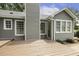 The back of house features a wooden deck area with siding and double-hung windows at 133 Creekstone Dr, Benson, NC 27504