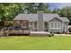 Backyard with a wood deck, a wood pergola, and green grass at 133 Creekstone Dr, Benson, NC 27504