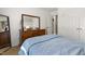 Bedroom boasts a spacious dresser, a full-length mirror, and ensuite bathroom access for added convenience at 133 Creekstone Dr, Benson, NC 27504