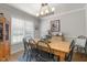 Dining room with a wooden table, chairs, and natural light presents a comfortable space for meals at 133 Creekstone Dr, Benson, NC 27504