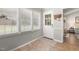 Sunlit entryway with window blinds, white trim and a coat rack provides a charming welcome at 133 Creekstone Dr, Benson, NC 27504