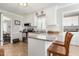 Bright kitchen featuring granite countertops, white cabinets, stainless steel appliances and adjacent breakfast bar at 133 Creekstone Dr, Benson, NC 27504