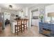 Well-lit kitchen with granite countertops and an adjacent laundry area offers convenience and style at 133 Creekstone Dr, Benson, NC 27504