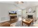 Inviting living space with a fireplace and a view of the dining room at 133 Creekstone Dr, Benson, NC 27504