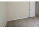 This bedroom features neutral walls and plush carpeting at 136 Sycamore St, Cary, NC 27513