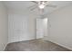 This bedroom features neutral walls, plush carpeting, and a large closet at 136 Sycamore St, Cary, NC 27513