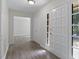 Inviting foyer with wood-look floors and views into adjacent rooms, creating an open feel at 136 Sycamore St, Cary, NC 27513