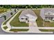 Aerial view showing a home on a corner lot in a residential area with manicured lawns at 1401 Justice Union Ct, Raleigh, NC 27604