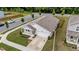 Aerial view of a well-maintained home with a driveway and landscaping in a suburban neighborhood at 1401 Justice Union Ct, Raleigh, NC 27604