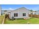 Backyard featuring a covered porch, raised garden beds, and privacy fence at 1401 Justice Union Ct, Raleigh, NC 27604