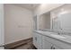Bathroom featuring double sink vanity with granite countertops and wood-look flooring at 1401 Justice Union Ct, Raleigh, NC 27604