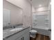 Bathroom boasts granite countertop, white vanity, and shower-tub combo with white surround at 1401 Justice Union Ct, Raleigh, NC 27604
