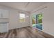 Bright dining area with wood flooring and sliding glass door with backyard view, connected to the kitchen at 1401 Justice Union Ct, Raleigh, NC 27604