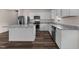 Bright kitchen featuring stainless steel appliances, granite countertops, and a center island with wood flooring at 1401 Justice Union Ct, Raleigh, NC 27604