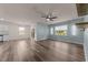 Open living room with wood flooring, open concept to kitchen/dining room, and lots of natural light at 1401 Justice Union Ct, Raleigh, NC 27604