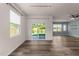 Spacious living room with wood flooring and a sliding glass door with backyard view and an open space concept at 1401 Justice Union Ct, Raleigh, NC 27604