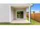 Covered patio with sliding glass door and privacy fence at 1401 Justice Union Ct, Raleigh, NC 27604