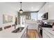 Modern kitchen showcasing stainless steel appliances, a large island, and white cabinets at 1408 Sawyer Rd # 103, Raleigh, NC 27610