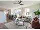Bright living room with a sofa, a ceiling fan, and an open concept floor plan perfect for entertaining at 1408 Sawyer Rd # 103, Raleigh, NC 27610