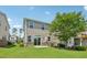 Backyard boasts a green lawn, a patio, and a well-kept exterior, blending nature with comfortable living at 1534 Glenwater Dr, Cary, NC 27519