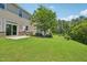 Spacious backyard with lush green grass, mature trees, and well-maintained landscaping at 1534 Glenwater Dr, Cary, NC 27519