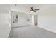 Bright bedroom with neutral carpet, two windows for ample light, and a ceiling fan for comfortable living at 1534 Glenwater Dr, Cary, NC 27519
