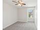Cozy bedroom featuring neutral carpet and a ceiling fan providing a comfortable and inviting space at 1534 Glenwater Dr, Cary, NC 27519