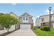 Charming two-story townhouse with a brick facade, white garage door, and well-maintained lawn and landscaping at 1534 Glenwater Dr, Cary, NC 27519