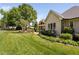 Charming backyard view featuring patio, screened-in porch and lush landscaping at 154 Sicily Dr, Clayton, NC 27527