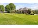 Expansive lawn and landscaping complement this home's exterior, creating a serene outdoor space at 154 Sicily Dr, Clayton, NC 27527
