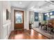Elegant foyer with hardwood floors, a decorative front door, and coffered ceilings at 154 Sicily Dr, Clayton, NC 27527