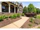 Beautifully landscaped front yard with a winding sidewalk leading to the front porch at 154 Sicily Dr, Clayton, NC 27527