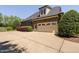 Spacious two-car garage with an extended driveway, situated beside an attractive brick home at 154 Sicily Dr, Clayton, NC 27527