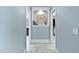 Light and airy hallway with decorative shelving and doorways leading to other rooms at 154 Sicily Dr, Clayton, NC 27527