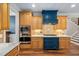 Beautiful kitchen with stainless steel appliances, custom cabinets, and stone countertops at 154 Sicily Dr, Clayton, NC 27527