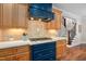 Close up of the kitchen stovetop and countertops featuring beautiful cabinets and modern appliances at 154 Sicily Dr, Clayton, NC 27527