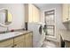 Functional laundry room with modern appliances, ample cabinet space, and natural light at 154 Sicily Dr, Clayton, NC 27527