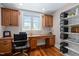Office space with custom wood built-ins, natural light and hardwood floors at 154 Sicily Dr, Clayton, NC 27527