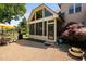 Enclosed patio with a full-glass wall, perfect for outdoor enjoyment with comfortable seating at 154 Sicily Dr, Clayton, NC 27527