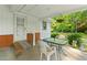 Cozy covered back patio with outdoor seating at 1593 E Washington Ave, Creedmoor, NC 27522