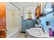 Bathroom featuring a tub, sink, medicine cabinet and window with natural light at 1593 E Washington Ave, Creedmoor, NC 27522