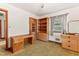 Bright bedroom offering vintage shelving, natural light from windows, and retro carpet at 1593 E Washington Ave, Creedmoor, NC 27522