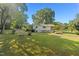 Cozy home with a well-maintained lawn and mature trees at 1593 E Washington Ave, Creedmoor, NC 27522