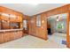 Eat-in kitchen features wood cabinets and open design at 1593 E Washington Ave, Creedmoor, NC 27522