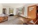 Spacious living room with natural light, carpeted floors, and classic furnishings at 1593 E Washington Ave, Creedmoor, NC 27522